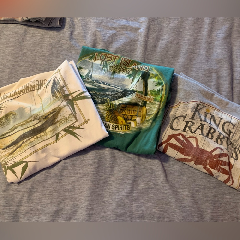 Paradise Shores decal on back Tshirts